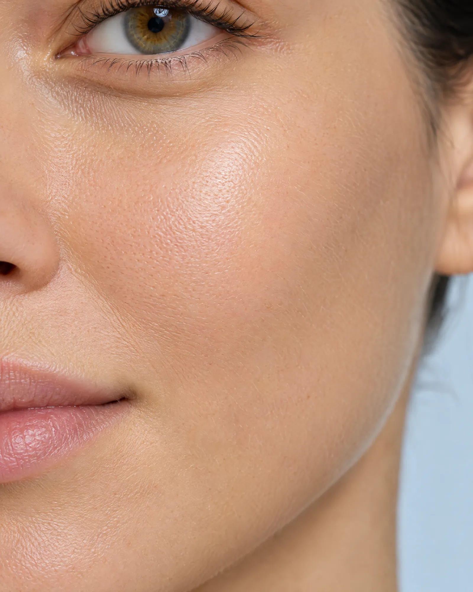 Macro photograph of smooth, healthy cheek skin